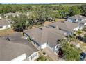 Bird's eye view of residential homes showcasing their location with lush greenery and mature trees nearby in the surrounding area at 1840 Shumard Ave, St Cloud, FL 34771