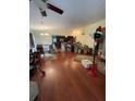 Spacious living room boasts hardwood floors, chandelier lighting and lots of space at 3327 Toasy Dr, Orlando, FL 32806
