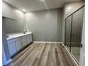 The primary bathroom features double sinks, a large mirror, and a separate glass-enclosed shower at 4009 Maggie Loop, Lakeland, FL 33813