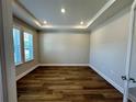 Bright office space featuring wood flooring and ample natural light from large windows at 4015 Maggie Loop, Lakeland, FL 33813
