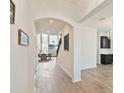 Welcoming entryway with elegant tile flooring, arched doorway, and an open view to the living area at 1539 Wynell St, St Cloud, FL 34771