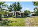 Charming home featuring a cozy front porch and well-maintained landscaping at 3601 Midiron Dr, Winter Park, FL 32789