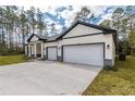 This house has a long driveway, a two-car garage and great curb appeal at 3777 Sw 130Th Loop, Ocala, FL 34473