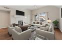 Bright and airy living room with vaulted ceiling, fireplace, and views of the balcony at 390 Lake Placid Ct # 304, Altamonte Springs, FL 32701
