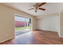 Bright living room with hardwood floors and sliding glass doors leading to the outside at 7336 Daniel Webster Dr # 9, Winter Park, FL 32792