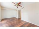 Spacious living room featuring hardwood floors and a ceiling fan at 7336 Daniel Webster Dr # 9, Winter Park, FL 32792