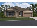 Charming single-story home featuring a neutral color palette, stone accents, and a well-manicured lawn at 756 Pointe Emerson Blvd, Apopka, FL 32703