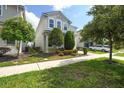 Charming two-story home featuring a well-maintained yard and attached garage at 9007 Pelican Cove Trce, Kissimmee, FL 34747