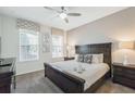 Comfortable bedroom with carpet, ceiling fan, and large windows for natural light at 9007 Pelican Cove Trce, Kissimmee, FL 34747