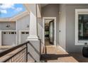 Stylish home exterior with an inviting open doorway and a glimpse of the interior at 9405 Bordet Ct, Orlando, FL 32827