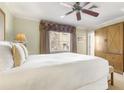 Bright bedroom with a large window and a wooden wardrobe with bench seating at 1370 Centre Court Ridge Dr # 204, Reunion, FL 34747