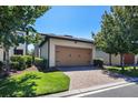 Spacious detached two-car garage with brick-paved driveway surrounded by green lawns and mature trees at 14131 Lakeview Park Rd, Winter Garden, FL 34787