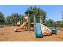 Community playground featuring climbing structures, slides, and a soft wood chip surface at 14131 Lakeview Park Rd, Winter Garden, FL 34787