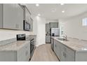 Well-equipped kitchen with granite countertops, stainless steel appliances, and ample cabinet space at 17847 Adrift Rd, Winter Garden, FL 34787