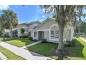Inviting single-story home with a neatly landscaped front yard at 2112 Cypress Bay Blvd, Kissimmee, FL 34743