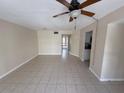 Bright, open living room featuring neutral walls and tile flooring at 4328 Aqua Vista Dr # B, Orlando, FL 32839