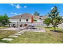 Spacious backyard featuring a paved patio with ample seating, perfect for outdoor entertaining at 5431 White Heron Pl, Oviedo, FL 32765