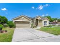 Beautiful single-story home with desert landscaping, front-facing garage and quaint architectural detail at 5431 White Heron Pl, Oviedo, FL 32765
