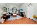 Bright living room features a decorative fireplace and sliding glass doors at 5431 White Heron Pl, Oviedo, FL 32765