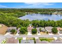 Beautiful lakeside homes in a quiet suburban neighborhood with tree lined streets and well maintained lawns at 555 Carey Way, Orlando, FL 32825