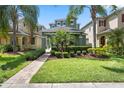 Inviting two-story home with a brick walkway and meticulously maintained front yard at 15160 Avenue Of The Arbors, Winter Garden, FL 34787