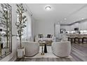 Bright living room featuring modern decor, hardwood floors, and stylish furnishings at 15160 Avenue Of The Arbors, Winter Garden, FL 34787