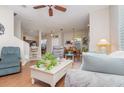 Inviting living room features hardwood floors, neutral tones, and comfortable seating, creating a relaxing atmosphere at 3321 San Jacinto Cir # 116, Sanford, FL 32771
