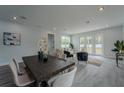Dining room that leads to a living room with an open floor plan at 59 W 10Th St, Apopka, FL 32703