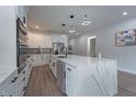 Spacious kitchen features a large center island with modern appliances and lighting at 59 W 10Th St, Apopka, FL 32703