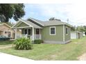Quaint home with a front porch and a spacious, well-manicured lawn at 1312 7Th St, St Cloud, FL 34769