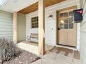 Inviting front porch features a seating area, stone flooring and wood ceiling at 236 N Ranger Blvd, Winter Park, FL 32792
