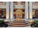 Grand entrance featuring brick steps, white columns, and decorative glass doors at 690 E Church St, Bartow, FL 33830