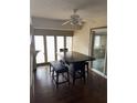 Inviting dining room area with large table, comfortable seating, ceiling fan, and natural light at 1105 Mill Run Cir, Apopka, FL 32703