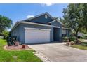 Charming single-story home with a well-maintained lawn and driveway at 1868 Rachels Ridge Loop # L, Ocoee, FL 34761
