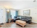 Cozy living room with a comfortable sectional sofa and large picture window at 1901 Rose Blvd, Orlando, FL 32839
