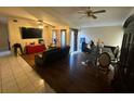 Inviting living room featuring a combination of tile and wooden flooring at 2212 Atrium Cir, Orlando, FL 32808
