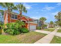 Charming two-story home featuring an attached two-car garage along a residential street at 2769 Lido Key Dr, Kissimmee, FL 34747