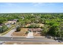 Expansive aerial view of a home, surrounded by lush greenery, highlighting its peaceful neighborhood setting at 4070 Mcneil Rd, Apopka, FL 32703