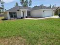 Well-maintained single-story home featuring a lush lawn and a convenient two-car garage at 4529 Sw 169Th Pl, Ocala, FL 34473