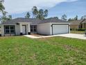 Inviting single-story home with a pristine lawn and freshly planted landscaping at 4529 Sw 169Th Pl, Ocala, FL 34473
