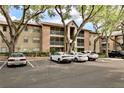 Apartment complex exterior featuring balconies and mature trees at 956 Salt Pond Pl # 207, Altamonte Springs, FL 32714