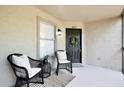Cozy condo patio with seating and natural light at 956 Salt Pond Pl # 207, Altamonte Springs, FL 32714