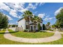 This beautiful two-story home includes tropical landscaping and a fenced-in yard at 1476 Pine Marsh Loop, St Cloud, FL 34771