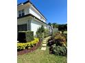 Side yard featuring stone pathway leading to gated entrance at 1690 Palm Ave, Winter Park, FL 32789