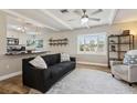 Open-concept living area with modern lighting, hardwood floors, and a view of the backyard at 4701 Goddard Ave, Orlando, FL 32804