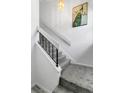 Bright and airy staircase with contemporary railings and neutral carpet at 3106 S Semoran Blvd # P-2, Orlando, FL 32822
