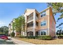 Beautiful multi-story condo with screened balconies and well-maintained landscaping at 3480 Soho St # 107, Orlando, FL 32835