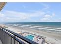 Relaxing ocean view from the balcony overlooking the beach and pool at 4139 S Atlantic Ave # B707, New Smyrna Beach, FL 32169