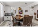 Cozy dining room with a rustic wooden table, seating for six, and stylish decor at 5637 Beggs Road, St Cloud, FL 34771