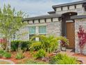 Manicured landscaping and stone facade accentuate the facade of this lovely home at 5637 Beggs Road, St Cloud, FL 34771